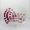 Vortex patterned glass plate with pink tiled detailing